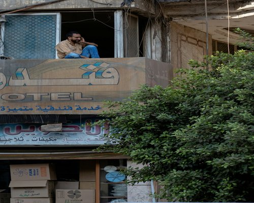 technician cleaning a wall mounted air conditioner in Cairo